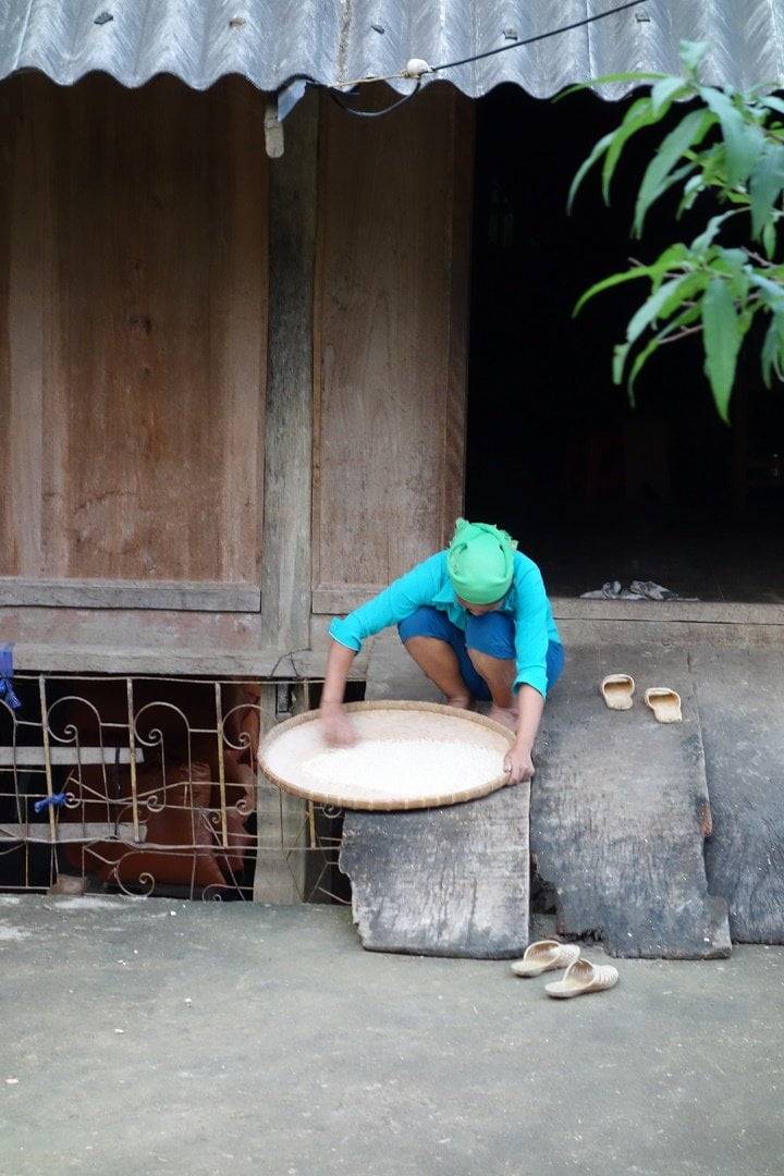 Local woman cleaning the rice - Du Gia - Vietnam