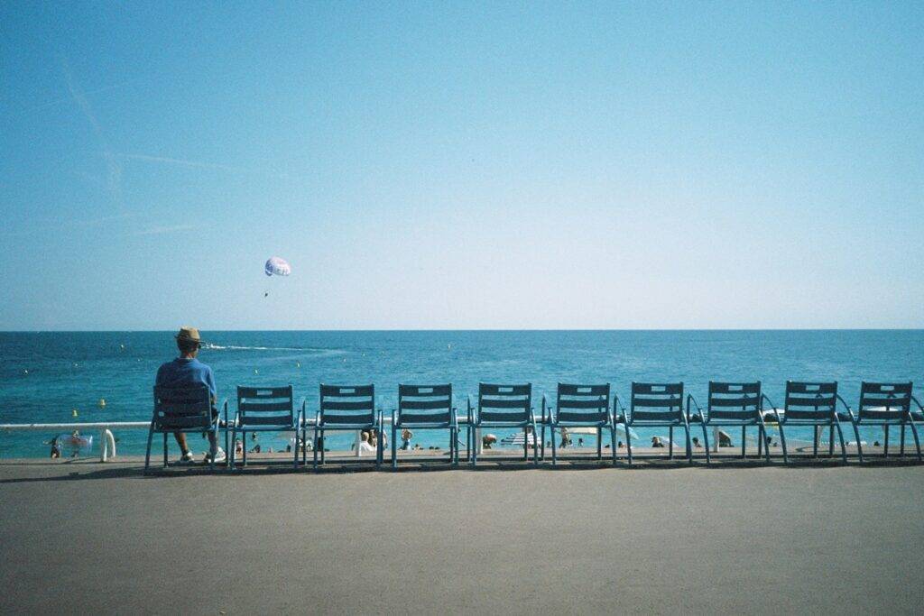 blue chairs of the Promenade des Anglais in Nice, France.