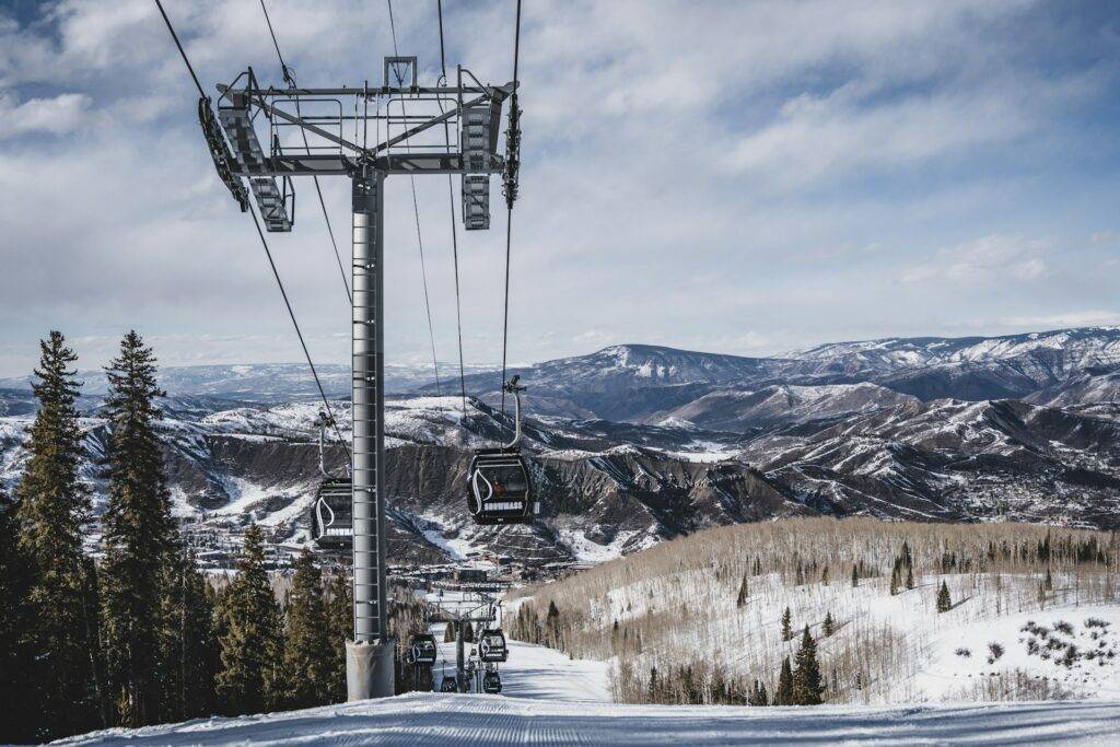 cable cars over snow covered mountain in Aspen Colorado