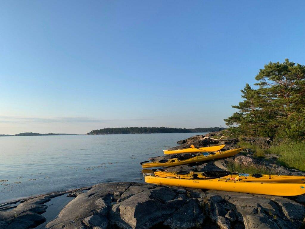 Sea kayaks along the shoreline of the Stockholm Archipelago